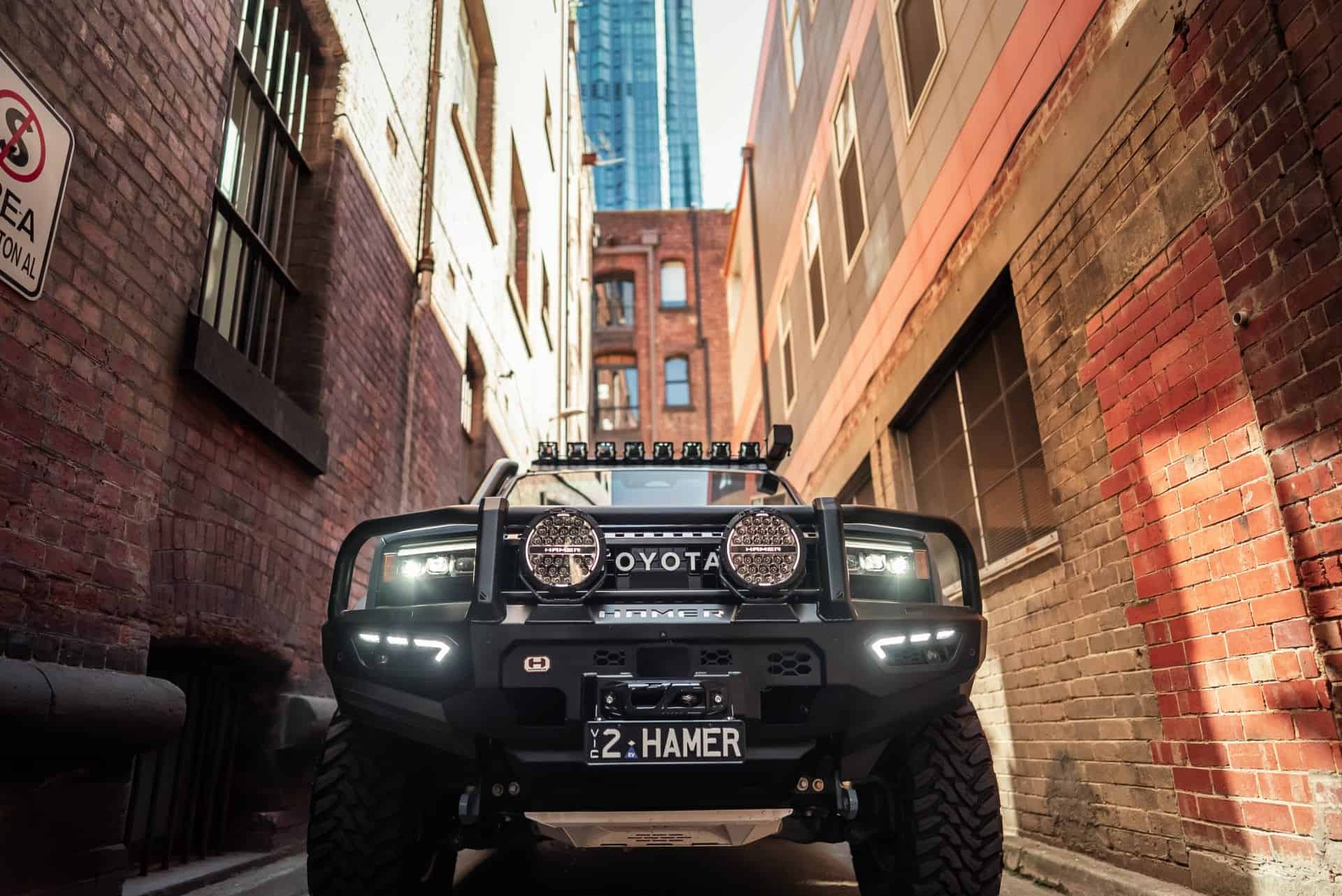 Toyota Landcruiser Prado 250 Series with West Coast Off Road bull bar in an urban alleyway.