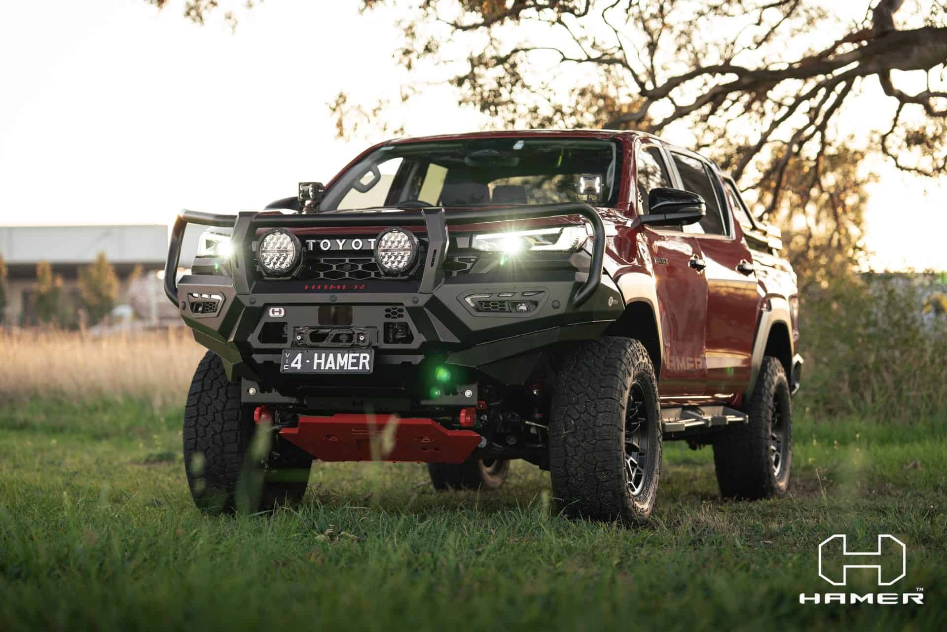 Toyota Hilux with West Coast Off Road Atlas Series Plus bull bar at sunset.