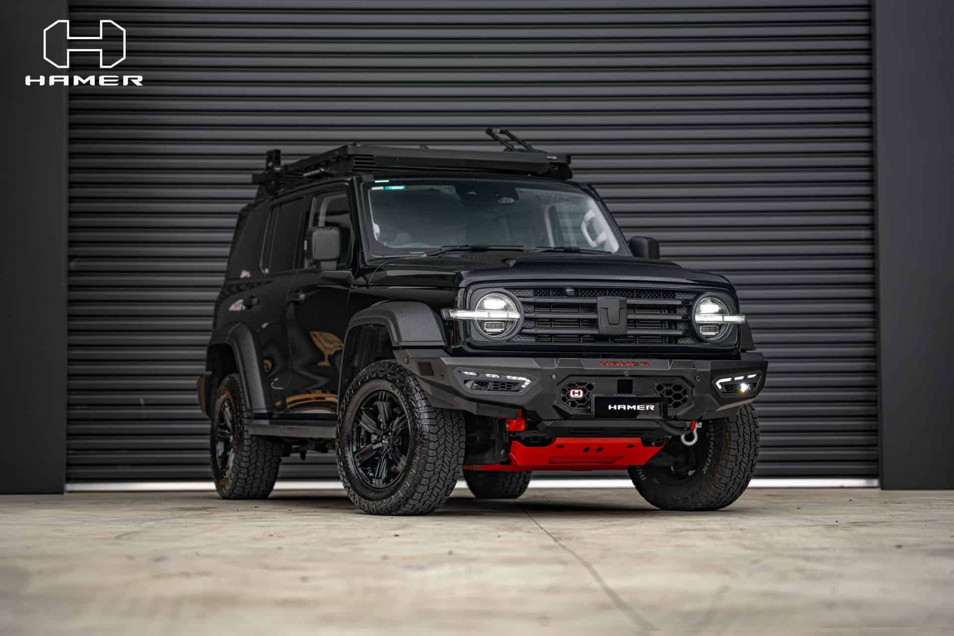 Black GWM Tank 300 with West Coast Off Road Atlas bull bar in black and red.