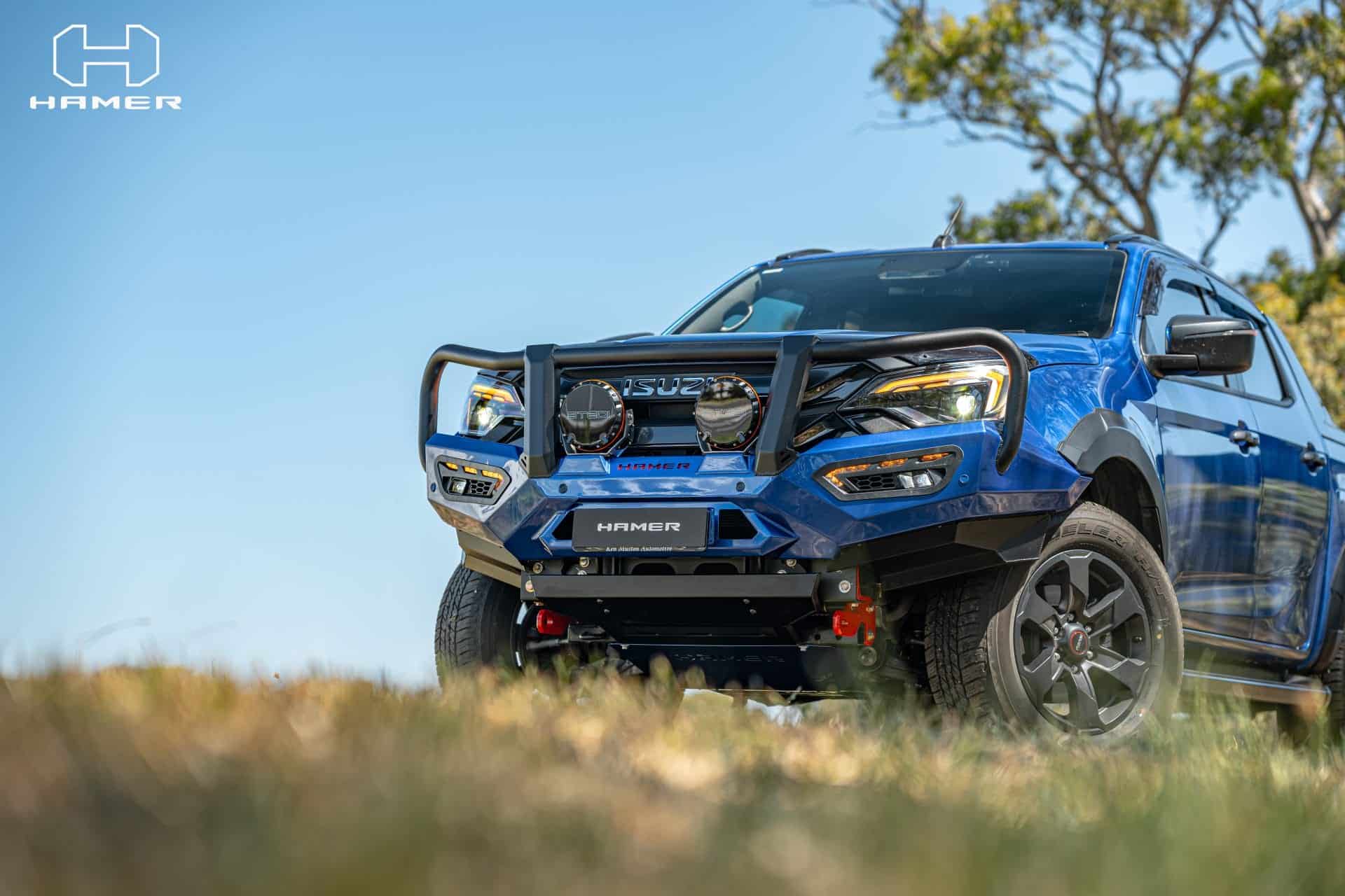 Blue Isuzu D-Max with West Coast Off Road bull bar and off-road accessories.